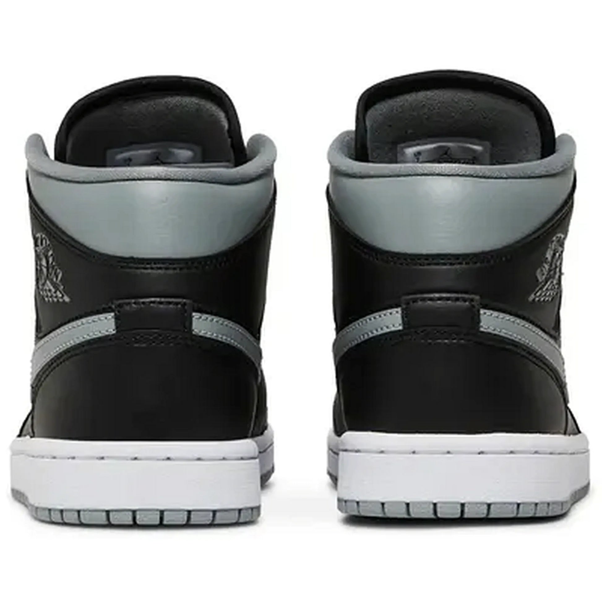 Nike Air Jordan 1 Mid Wmns Shadow – Damen Sneaker in Schwarz und Grau, Rückansicht des Paars mit hellgrauem Schaft und klassischer Air Jordan Silhouette.