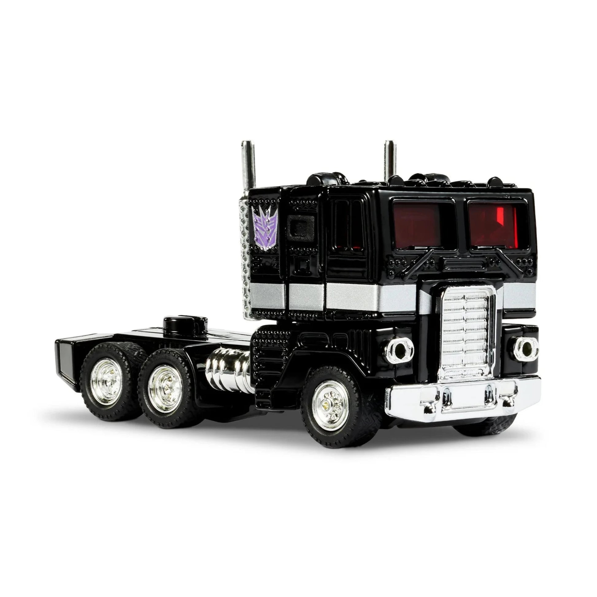 Hot Wheels Nemesis Prime Diecast Truck – schwarzer Sammlertruck mit silbernen Akzenten, rotem Cockpit und Decepticon-Logo, detailreiches Premium-Modell auf weißem Hintergrund.